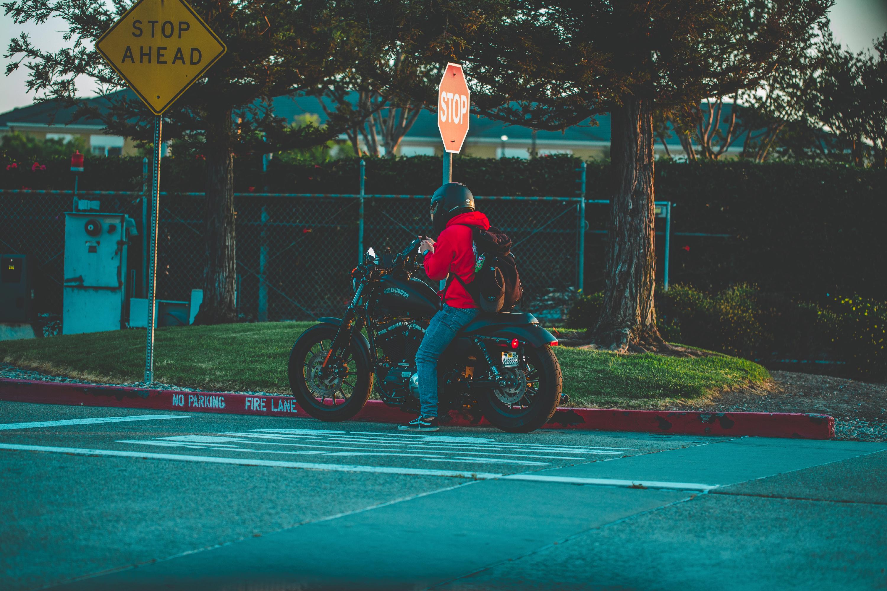 A motorcycle against a red curb